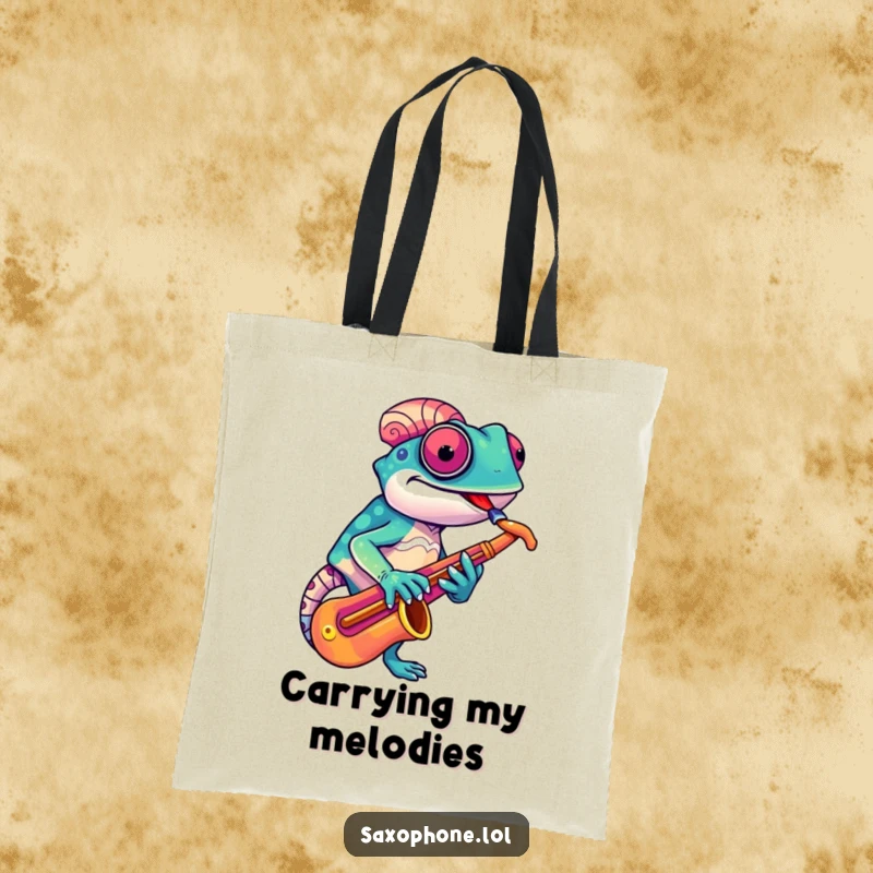Funny Chameleon Sax Tote Bag: A vibrant chameleon adjusts its saxophone with a quirky grin, a stylish and humorous bag.